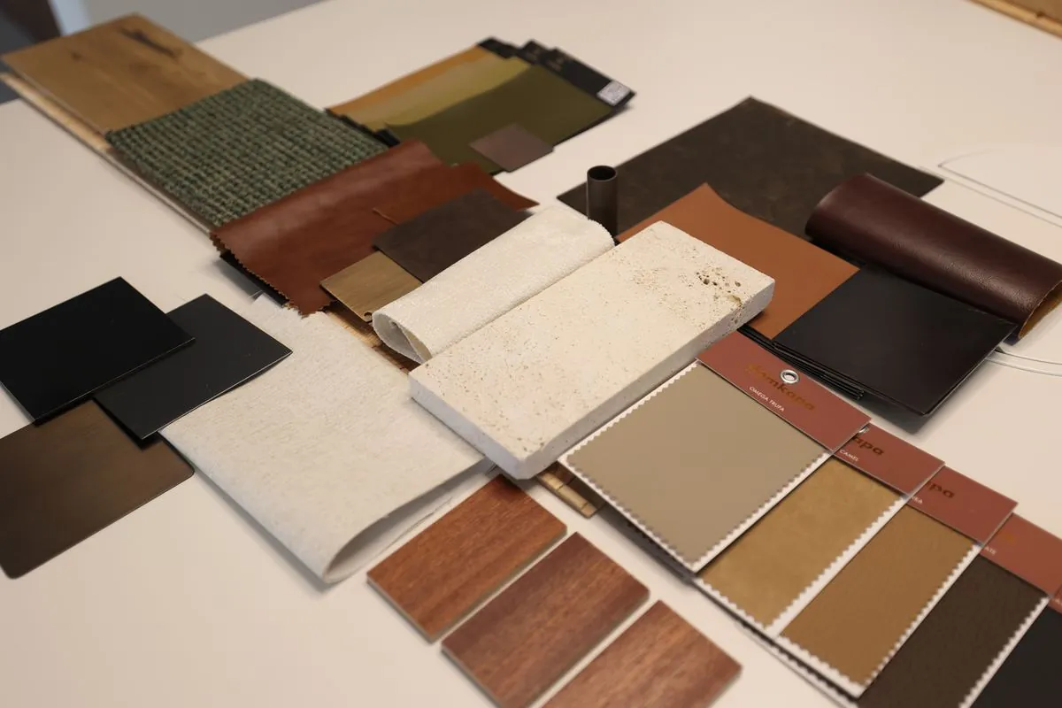 Stone, timber veneer, leather and fabric samples laid out for an office concept at the Fajr studio