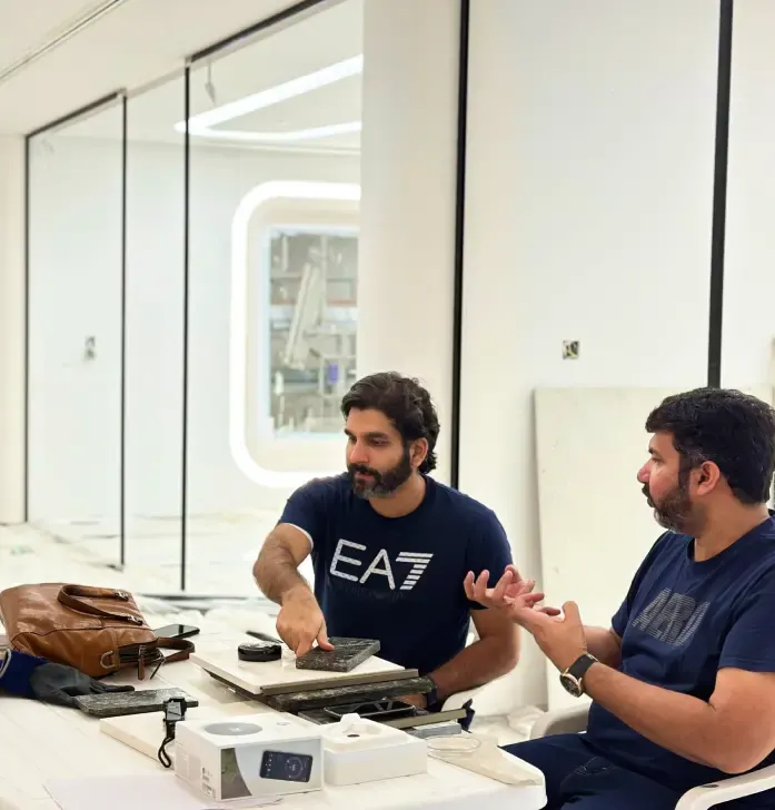 Fajr team reviewing stone and material samples on site, Dubai