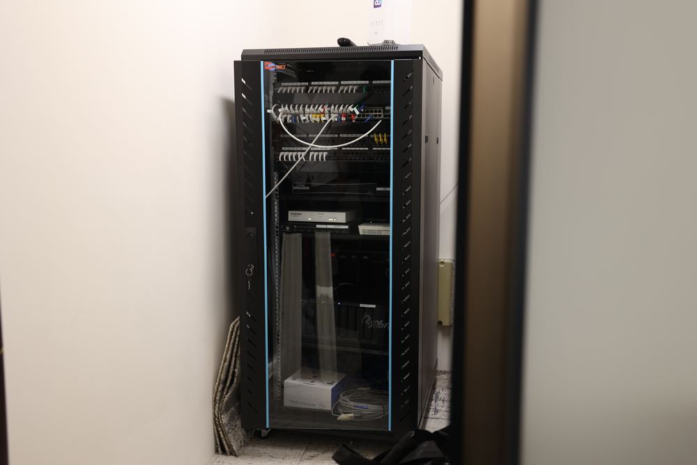 AV and automation rack during installation on a Fajr Interiors office floor, Dubai