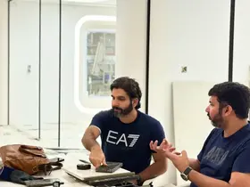 Fajr Interiors team at a table with samples and drawings, design stage