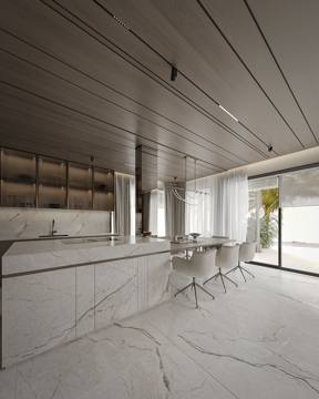 Render of the kitchen for Cluster 39, Villa 3: a long marble island and full-height stone wall