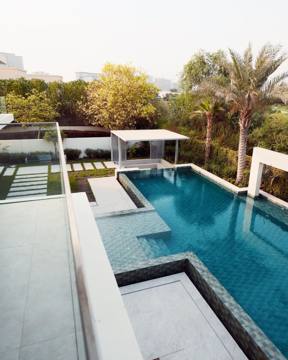 Terrace and pool at Villa 47 Fairways, seen from above at golden hour