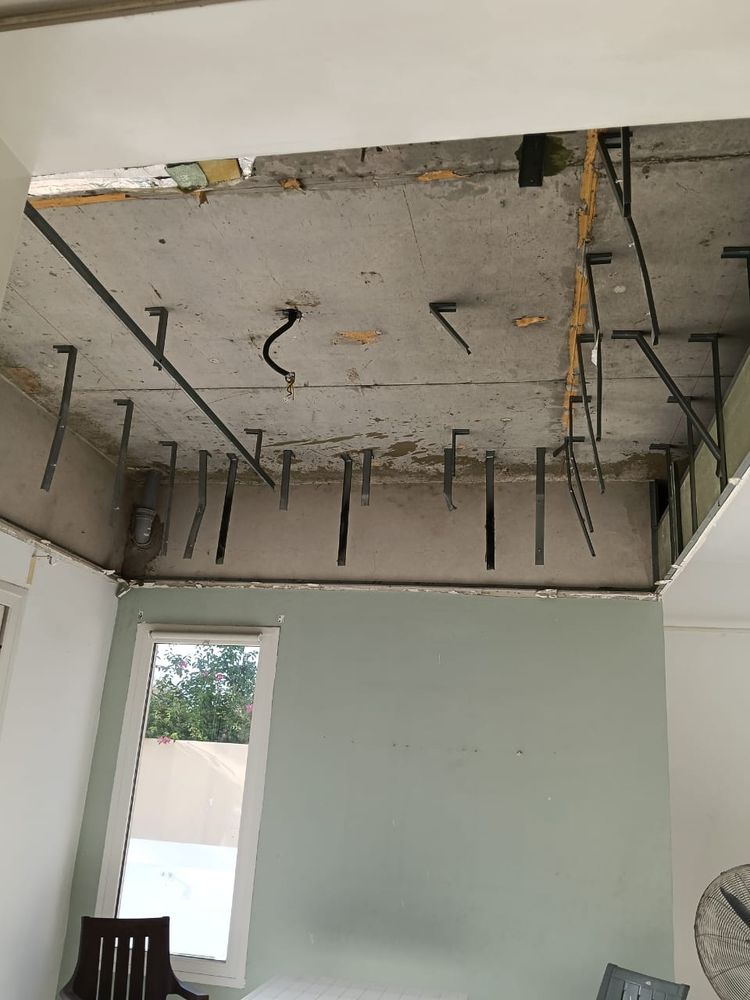 A ceiling opened during a villa renovation in The Springs, with the hangers for the new ceiling in place