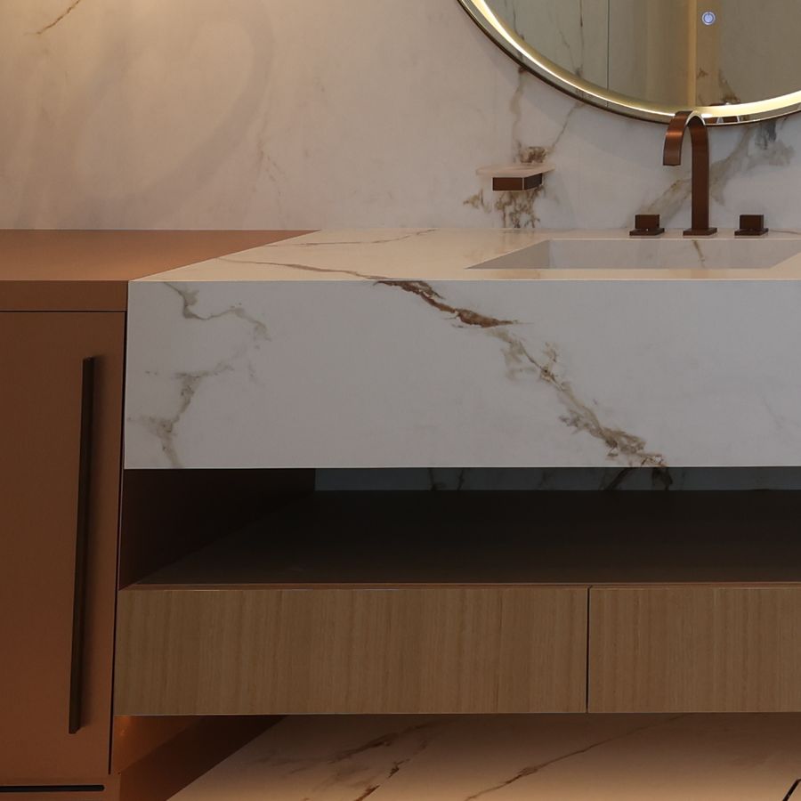Timber vanity joinery under a marble top in a villa bathroom delivered by Fajr Interiors