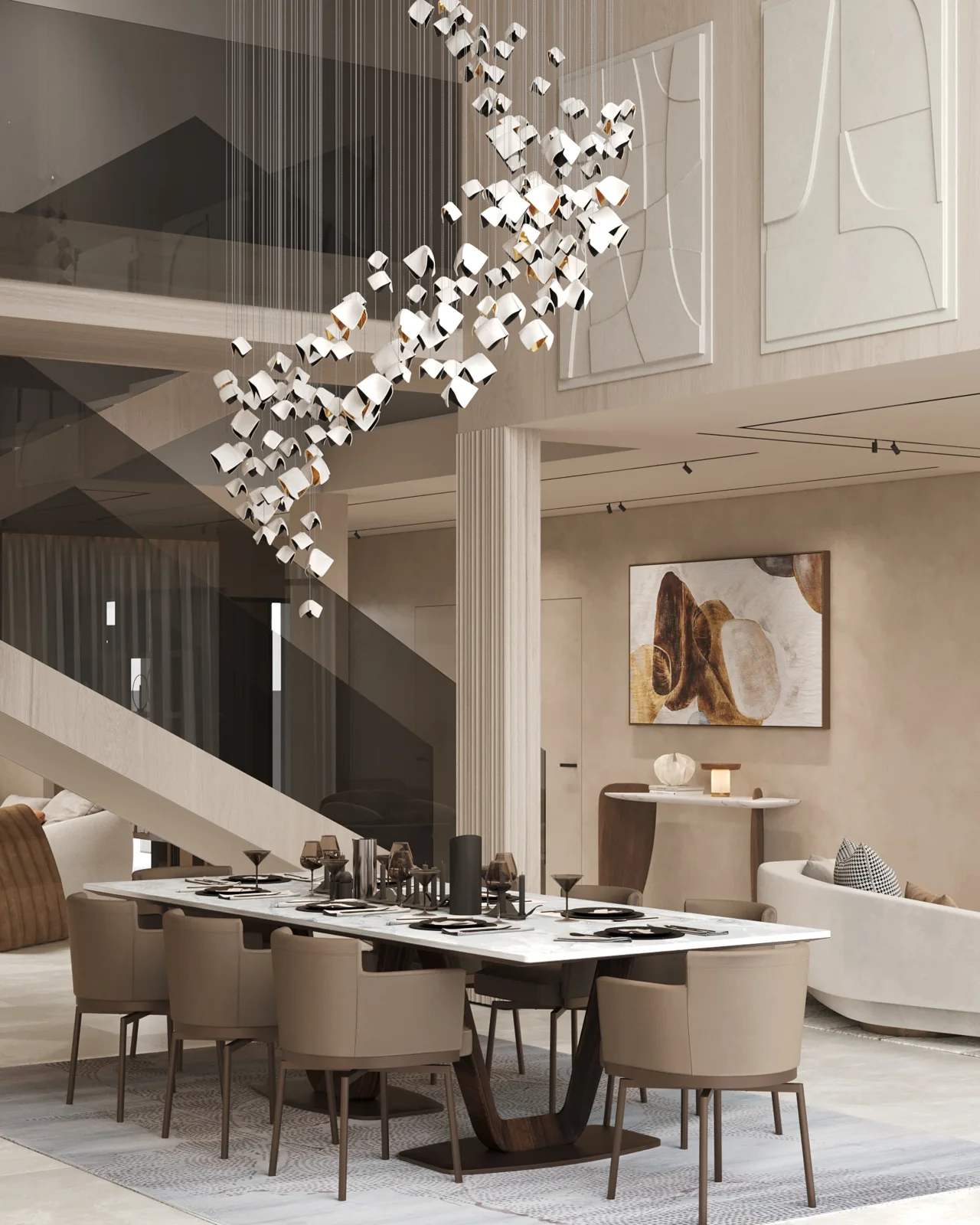 Render: double-height dining room with a cascading chandelier of white folded shades over a long marble table, a stair with a smoked-glass balustrade behind