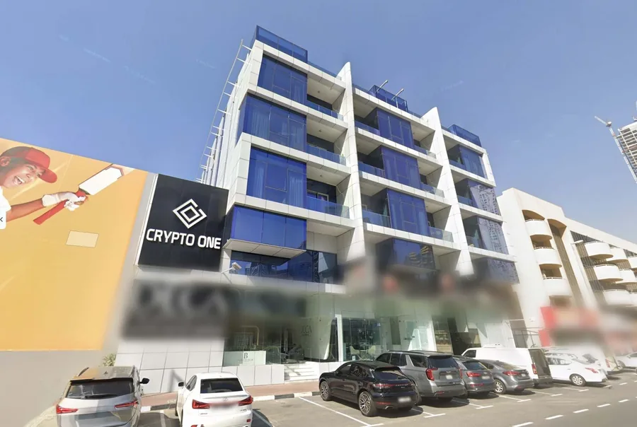 The Crypto One building on Sheikh Zayed Road, Dubai, with the Crypto One sign on the facade