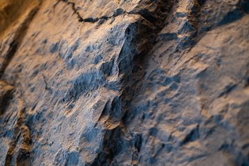 Photograph: stone wall, detail, the IMI at One Za'abeel office fitout by Fajr Interiors