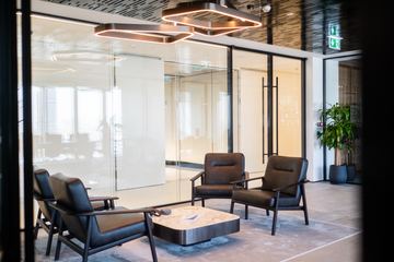 Photograph: lounge seen through glass, the IMI at One Za'abeel office fitout by Fajr Interiors
