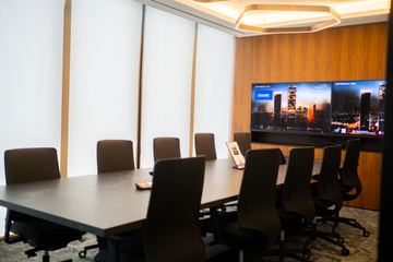 Photograph: meeting room, timber wall and screens, the IMI at One Za'abeel office fitout by Fajr Interiors
