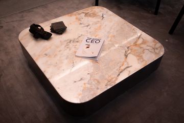 Photograph: stone coffee table, detail, the IMI at One Za'abeel office fitout by Fajr Interiors