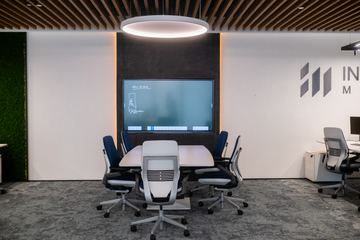 Photograph: team table and screen wall, the IMI at One Za'abeel office fitout by Fajr Interiors