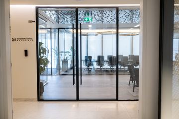 Photograph: the entrance door, the IMI at One Za'abeel office fitout by Fajr Interiors