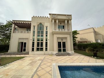 Photo: the back elevation of the villa before the works, the pool and paved terrace in front, Cluster 39, Villa 1, Jumeirah Islands