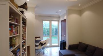 Photo: a family room before the works, bookshelves, a corner sofa and garden doors, Cluster 39, Villa 1, Jumeirah Islands