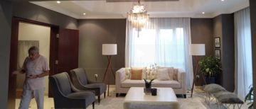Photo: the living room before the works seen from its doorway, a person standing by the door, Cluster 39, Villa 1, Jumeirah Islands