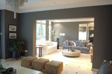 Photo: the sitting room before the works, seen through a wide opening in the dark living-room wall, Cluster 39, Villa 1, Jumeirah Islands
