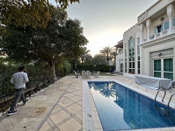 Photo: the pool and the side garden before the works, trees along the boundary wall, Cluster 39, Villa 1, Jumeirah Islands