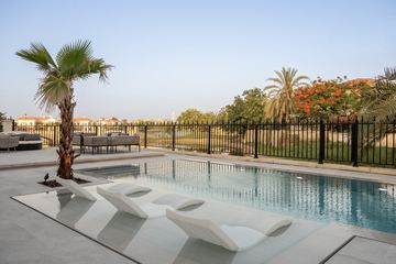 Photograph: in-pool loungers, the finished villa, Cluster 39, Villa 1, Jumeirah Islands, by Fajr Interiors