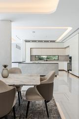 Photograph: dining, kitchen beyond, the finished villa, Cluster 39, Villa 1, Jumeirah Islands, by Fajr Interiors