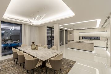 Photograph: dining and kitchen, the finished villa, Cluster 39, Villa 1, Jumeirah Islands, by Fajr Interiors