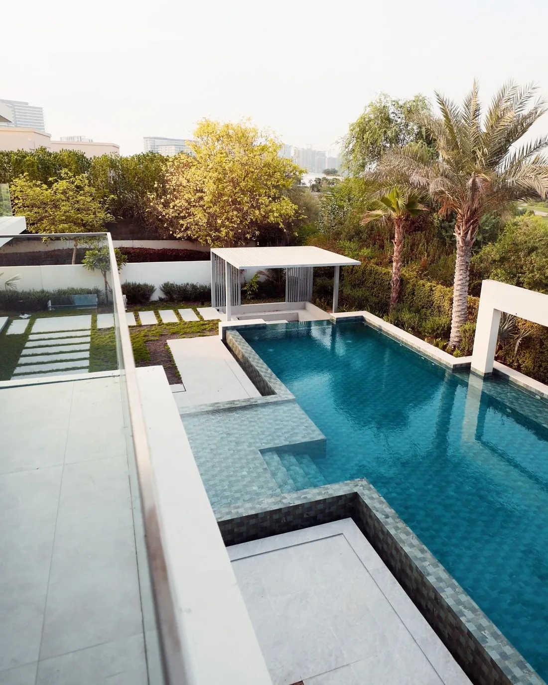 Photograph: Terrace and pool at Villa 47 Fairways, seen from above at golden hour